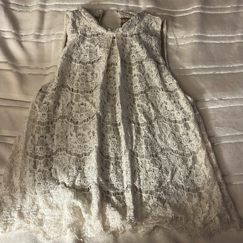 White lace sleeveless blouse